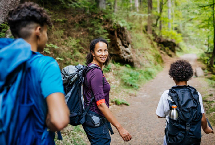 African American family hikes outdoors