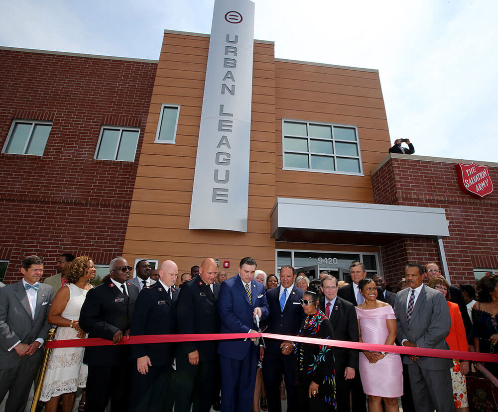 Michael Neidorff, National Urban League CEO and others cutting ribbon at the Community Empowerment Center in Ferguson, Missouri